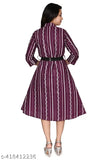 Purple patterned midi dress with a fitted waist, long sleeves