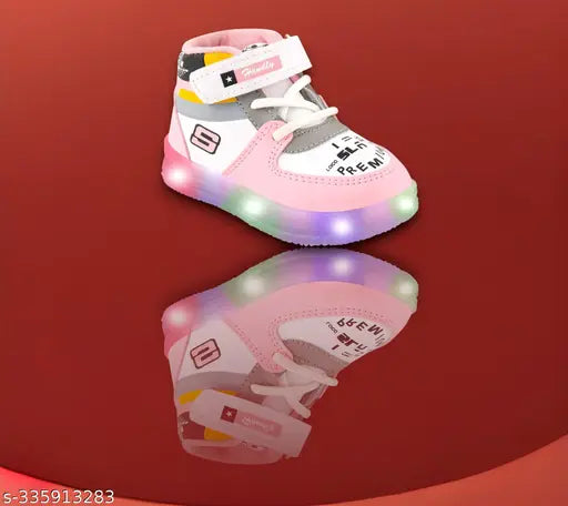 Pink and white children's glow-in-the-dark shoes with velcro straps