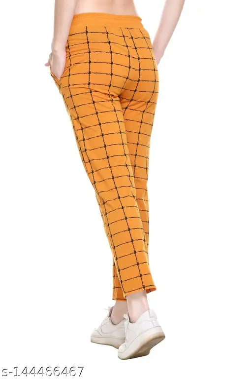 Orange women's track pants with checkered pattern
