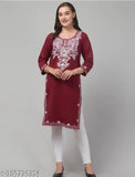 A person wearing a maroon AARI patti embroidered cotton kurta with white pants