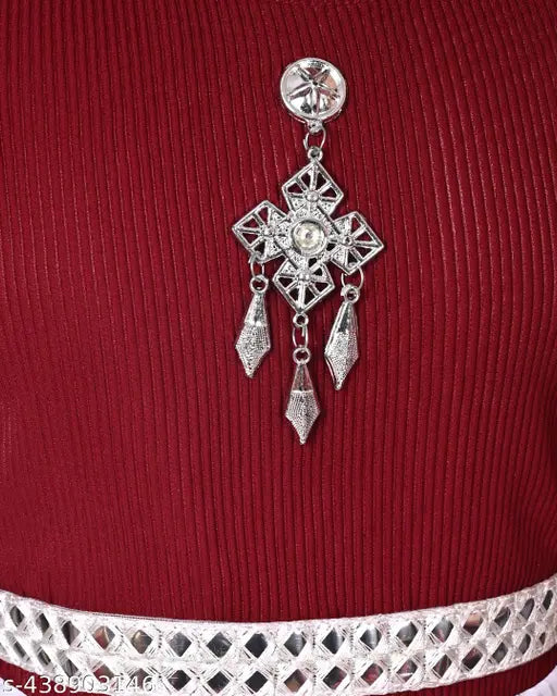 Red and silver beaded children's dress ornament, possibly a cross