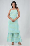 A model in a blue dress posing with a duppata