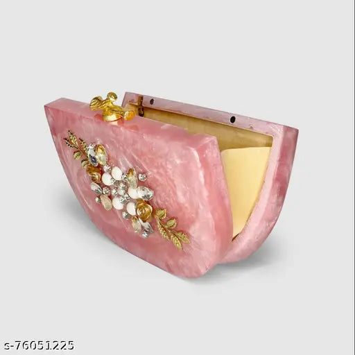 Pink resin D type clutch bag with a decorative closure and a chain