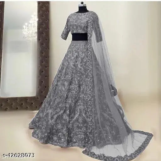 White taffeta silk Zari embroidered lehenga-choli set for women's wedding wear, traditional Indian party attire on display