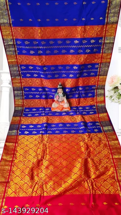 Traditional Indian saree with intricate pallu design and red border