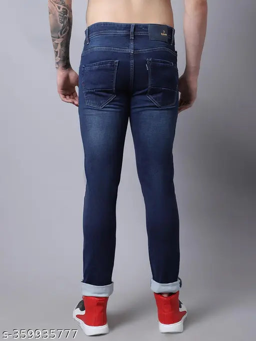Dark blue denim jeans with red sneakers in background