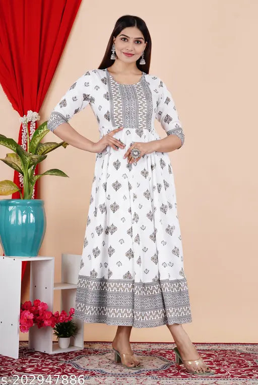 White Rayon Anarkali border print kurti with tassels, three-quarter sleeves, polka dot and border print pattern, suitable for semi-formal occasions