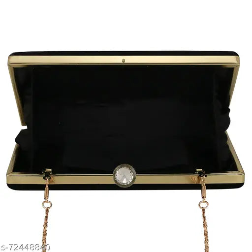Handcrafted black clutch with shiny surface, designed to carry essentials