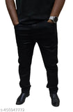 Black pants, standing against a solid background