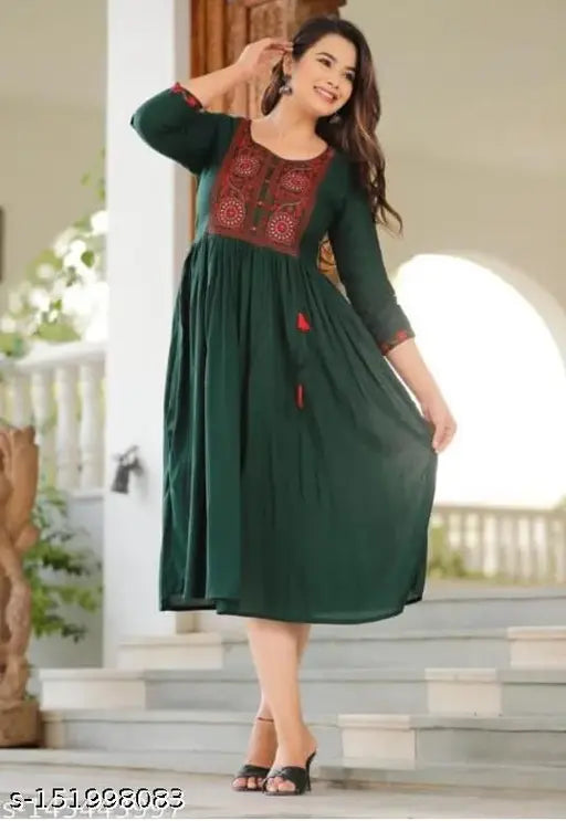 Green rayon solid embroidery kurti by Cotton India, three-quarter sleeves, S (36in bust, 46in size length) & XXL (44in bust, 46in size length). Elegant green kurti for year-round wear from India's most loved ethnic brand