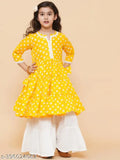 FH16YELLOW rayon printed three-quarter sleeve kurta and sharara set with lace work, yellow fancy sharara for kids on display