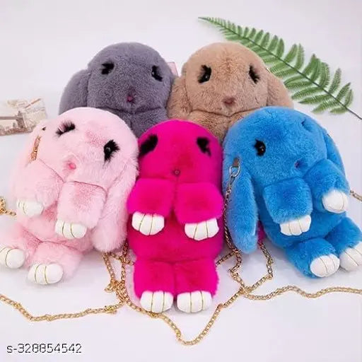 Multi-colored soft sling handbag featuring cute plush rabbit detail, ideal for girls' travel accessory
