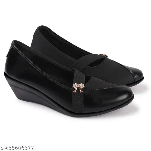 Black synthetic bellied shoes with buckle closure and bow embellishment