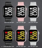 Black and white digital watch with pink band