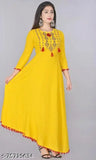 Yellow kameez with red embroidery, long sleeves and a flared bottom