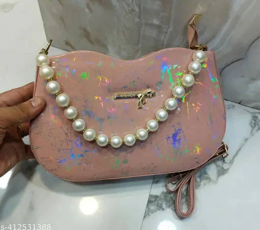 Stylish sling bag in marbled material, silver metal accents, pearl necklace design