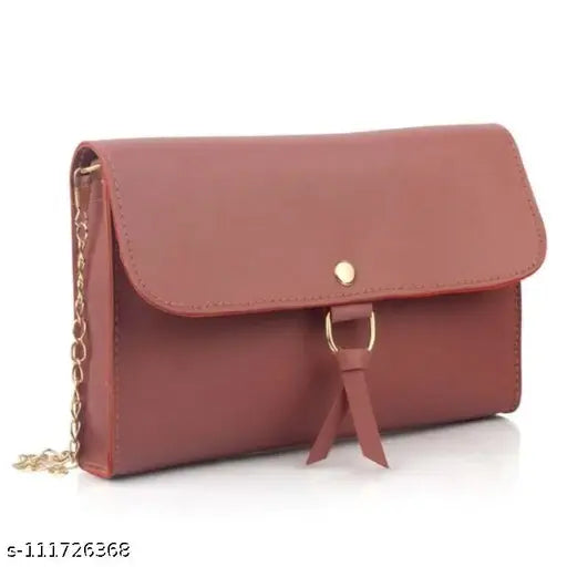 A red crossbody bag with a gold chain strap