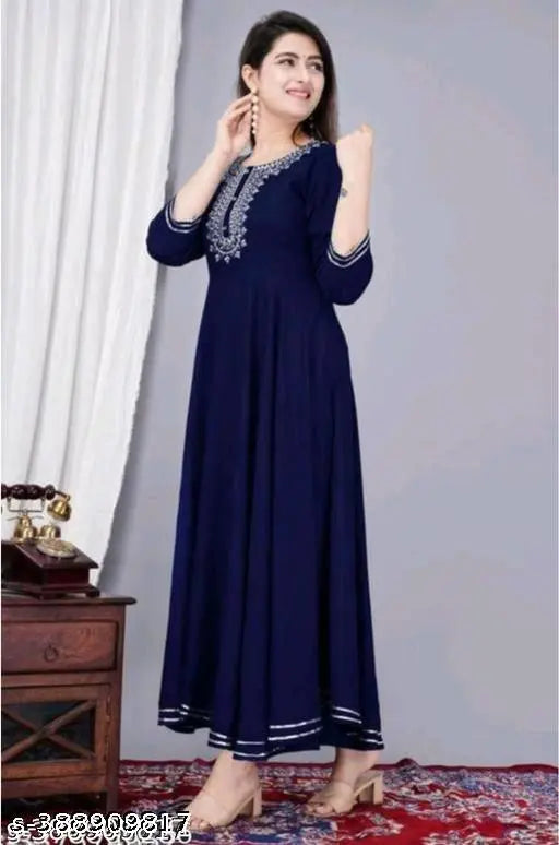 V-neck blue rayon gown, printed with colorful pattern. Sizes: S (36in), M (38in), L (40in), XL (42in), XXL (44in), XXXL (46in). Made in India