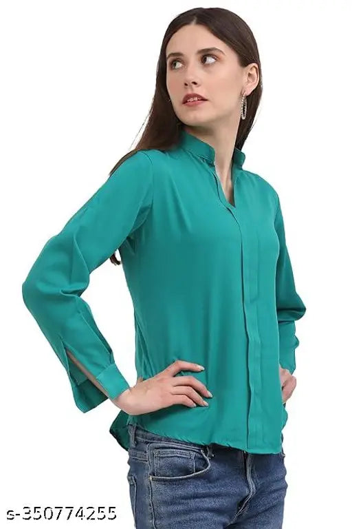 Jade green poly crepe formal top with notched neckline and full cuff sleeves for women, solid pattern on display