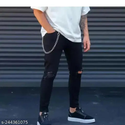 Denim men's knee-cut jeans with back print and dual pockets, dyed/washed for casual and party wear. Indian-origin jogger style jeans featuring zip and button rip-and-tear details at the knees, available in sizes 28, 30, 32