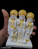 Yellow and gold ceramic figurines of Hindu gods Ram, Sita, Laxman, and Hanuman