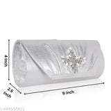 A glamorous silver sparkle evening clutch for women, embellished with a jeweled flower detail, perfect for weddings or parties