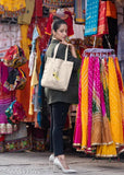 Black graphic print women's handbag with shoulder strap, suitable for travel or shopping