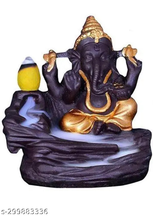 Golden Lord Ganesha smoke fountain with blue water and two yellow birds