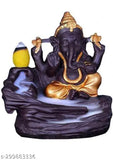 Golden Lord Ganesha smoke fountain with blue water and two yellow birds