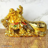 Gold polyresin Laughing Buddha with Money Potli for wealth, Vastu feng Shui decorative showpiece - 9cm (India)