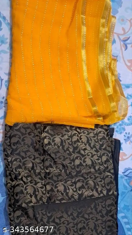 Yellow Georgette saree with separate Italian silk blouse piece, gold foil embellished, trending chiffon design for festive occasions like Diwali or Karwa Chauth