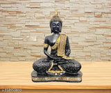Black marble Buddha statue with gold inlay on plaque, sitting cross-legged