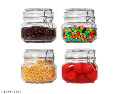 Clear glass jars with airtight lids, suitable for preserving dry food items such as pasta, spices, beans, and flour