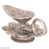 Silver metal diya with flower design, perfect for Pooja Mandir, office, or home decoration. Handcrafted Indian artifact, ideal for Diwali gifting