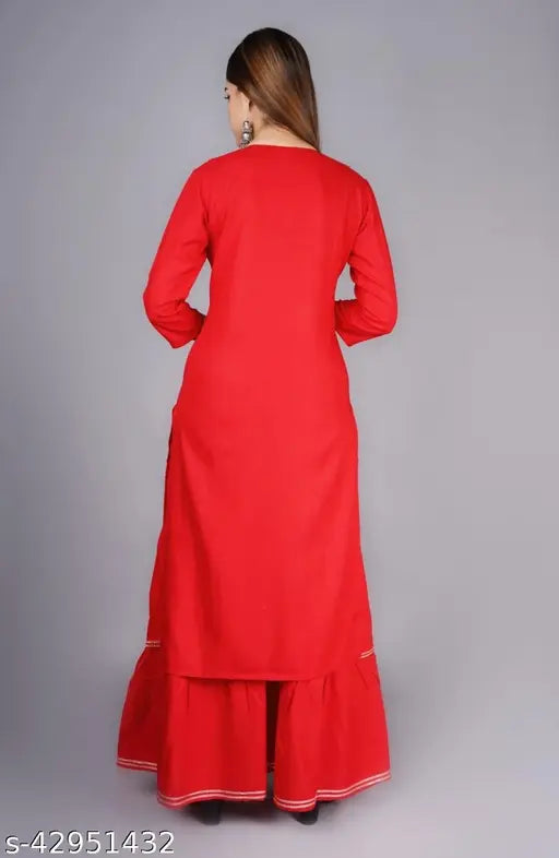 Red embroidered kurta set with mirror work and long sleeves