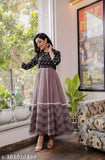 Woman in a purple kameez with black details