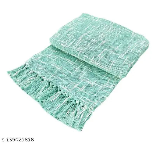 Soft, light blue fringed throw blanket for sofa and couch. Woven with a plush texture, this sofa throw cover measures 140 x 170 cm