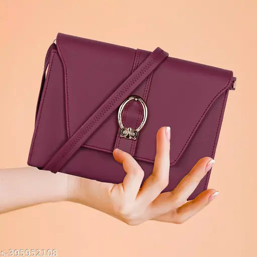 Purple leather sling bag with a chain closure