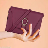 Purple leather sling bag with a chain closure