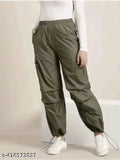 Green cargo pants with pockets and drawstrings, cropped length