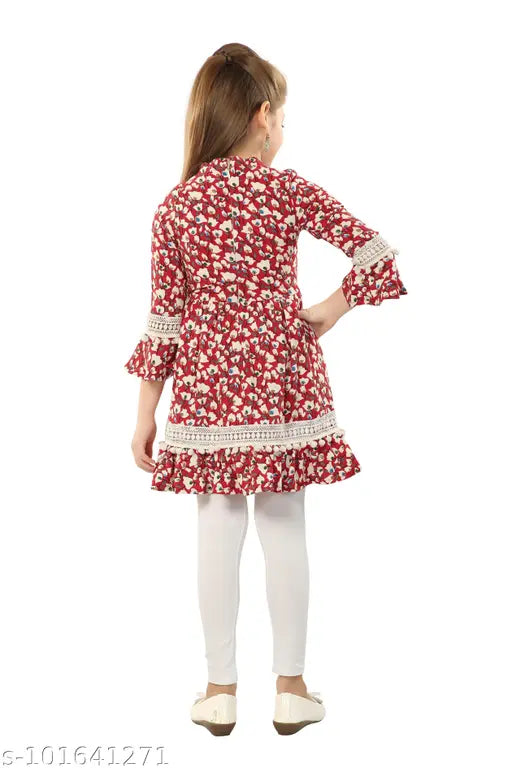 Printed polyester kurta set with lace and pom-pom details, cotton lycra churidar leggings, handcrafted neckline work. Children's size 5-12 years available. Indian ethnic wear for festive celebrations