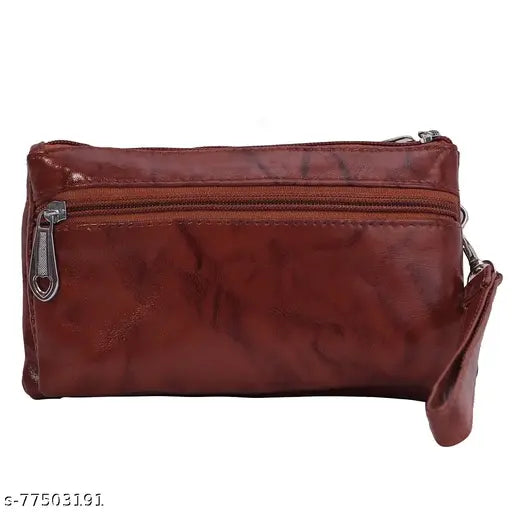 A brown, zippered wallet-type handbag with a smartphone holder
