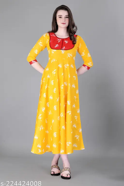 Yellow rayon kurta with flared sleeves and embroidered pompoms
