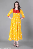 Yellow rayon kurta with flared sleeves and embroidered pompoms
