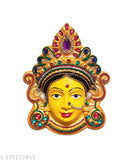 Yellow plastic figurine of Mahalakshmi face for worship, approximately 6 inches Height x 5 inches Width x 1.5 inches Depth (15 x 13 x 4 cm). Brings prosperity to home or office. Goddess of wealth and beauty from India