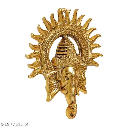 Golden metal Ganesh wall sculpture, intricate detailing, traditional Indian decor