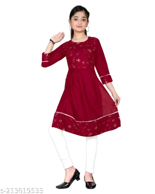 Rayon embroidered straight kurta for girls, three-quarter sleeves with embellished net pattern. Size: 10-11 years, 31 in top bust size, 35 in top length size. Made in India