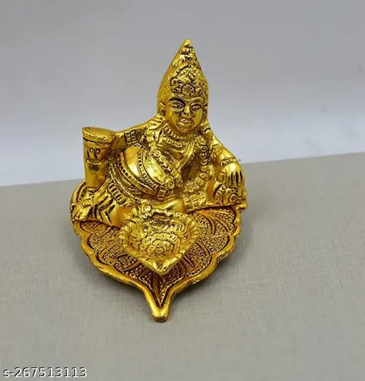 Golden Kuber Deepak with intricate design, rectangular shape, possibly used as a showpiece or for home decoration. 15cm x 9cm