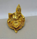 Golden Kuber Deepak with intricate design, rectangular shape, possibly used as a showpiece or for home decoration. 15cm x 9cm