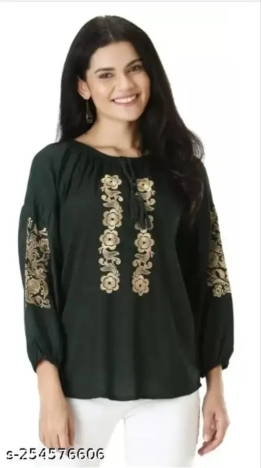 Green viscose rayon embroidered flared kurta with three-quarter sleeves and orange embellishments, popular women's rib crop top for girls and women